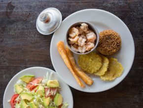 Shrimp with coconut rice, tostones, yucca and avocado salad.